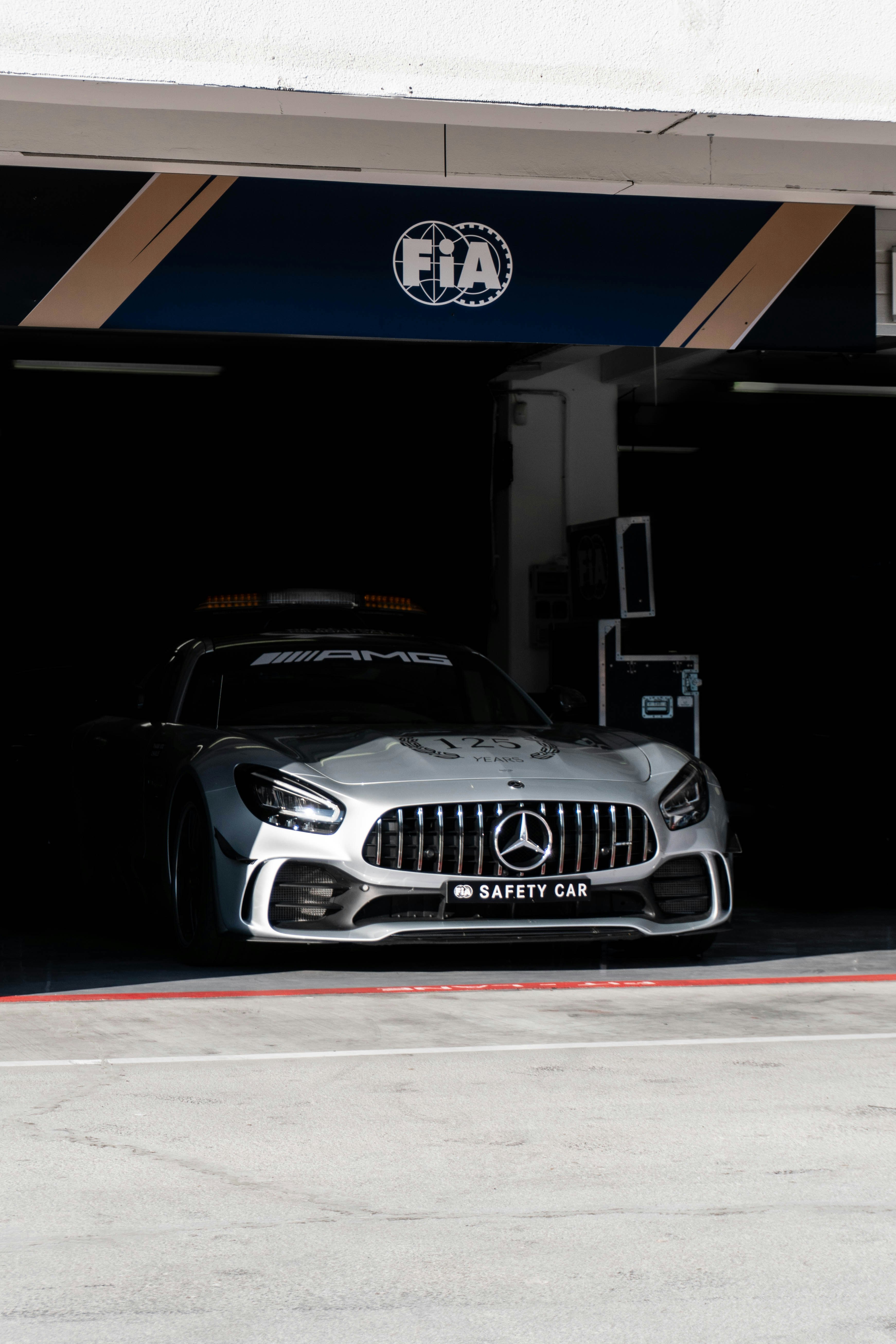 silver Mercedes Benz vehicle parked in garage